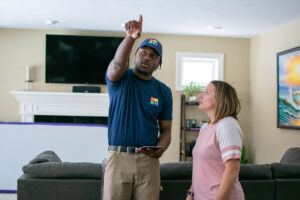 Alt text: Home Comfort technician speaking with an Illinois homeowner